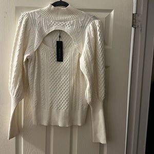 Beautiful cream sweater. Size Small (but runs big)